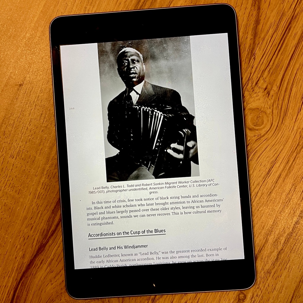 ebook page showing Lead Belly playing his accordion